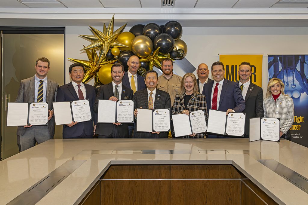 Leaders from the University of Missouri, Burns & McDonnell and the state of Missouri celebrate the signing of a major consulting agreement between the University of Missouri and Burns & McDonnell for NextGen MURR — a new, state-of-the-art research reactor at Mizzou.